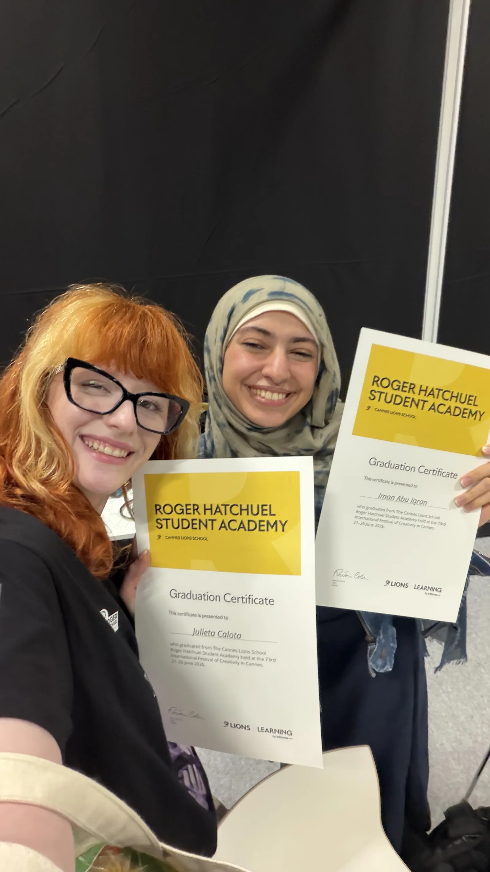 Holding the Roger Hatchuel Academy graduation certificate